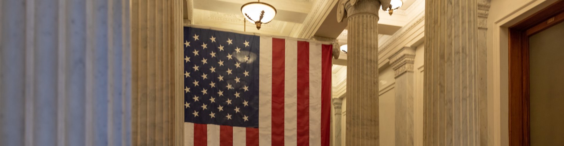 A US flag hanging at the corridor ceiling of US Capitol corridor ceiling, Interior, Washington DC.