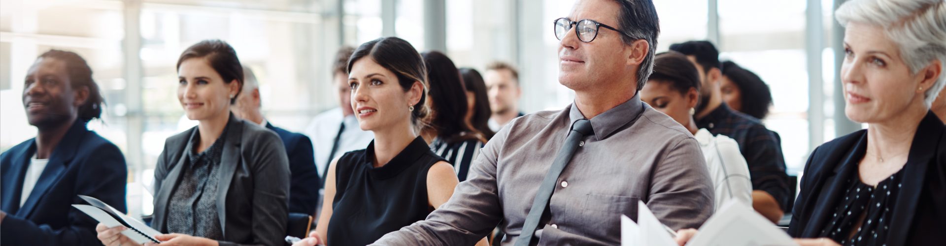 Shot of a group of businesspeople attending a conference