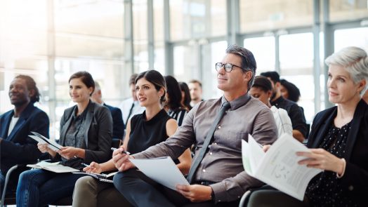 Shot of a group of businesspeople attending a conference
