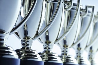 Close-up of a long row of trophies. Shot with shallow depth of field.