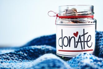 Donation money jar filled with coins