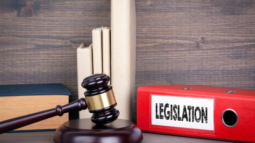 Legislation. Wooden gavel and books in background. Law and justice concept