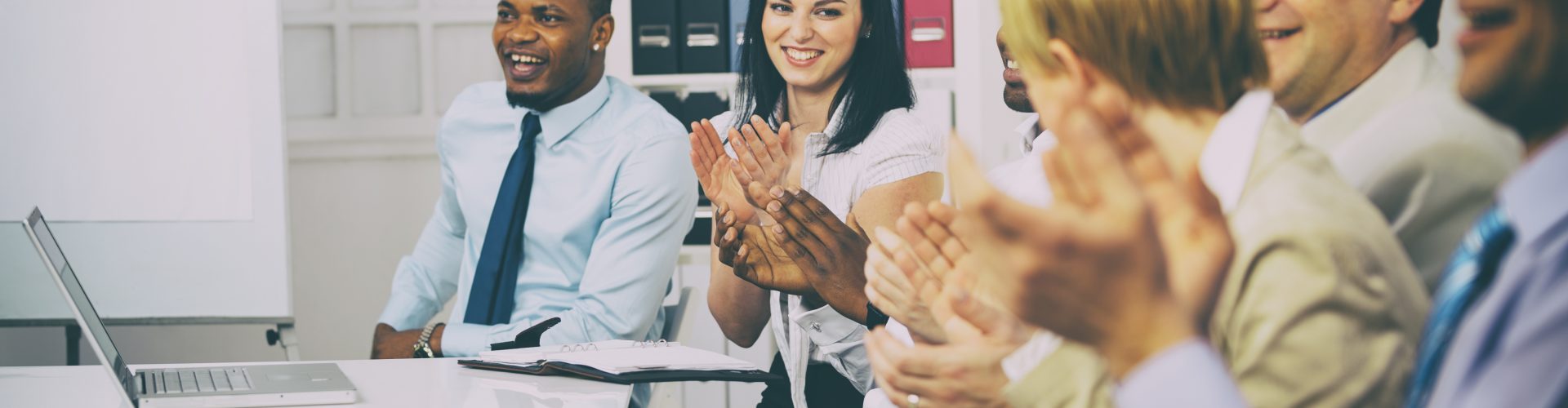 Business people clapping hands