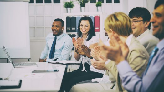Business people clapping hands