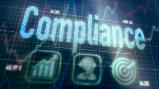 Compliance concept on a blue dot matrix computer display.