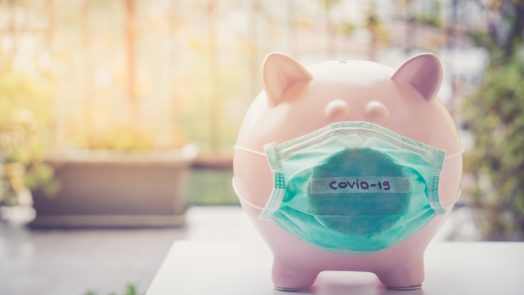 Piggy bank with Face Mask, Financial crisis and market crash due to virus spread.