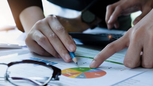 Asian business adviser meeting to analyze and discuss the situation on the financial report in the meeting room. Investment Consultant,Financial Consultant,Financial advisor and accounting concept