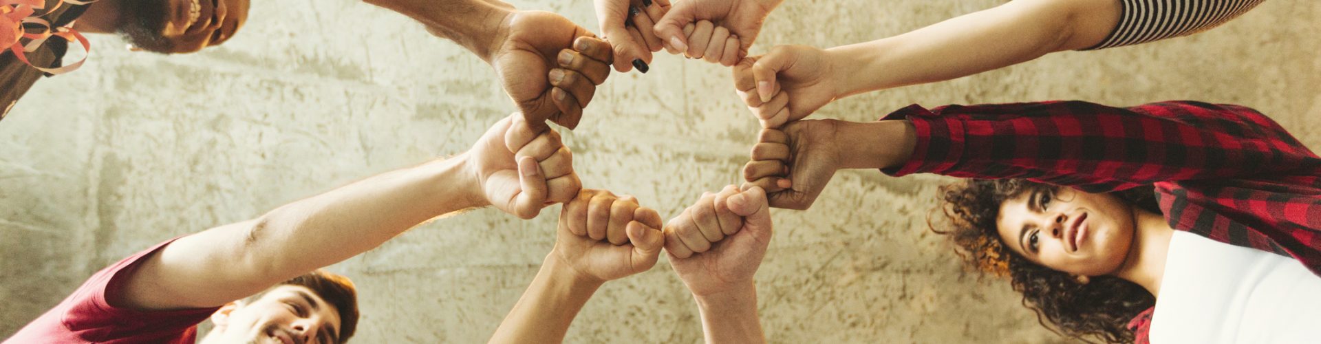 Group of people making fist bump. People solidaruty concept