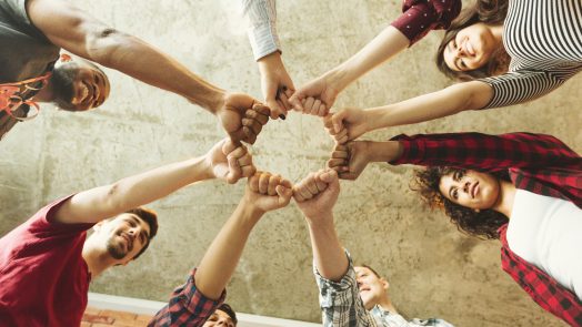 Group of people making fist bump. People solidaruty concept