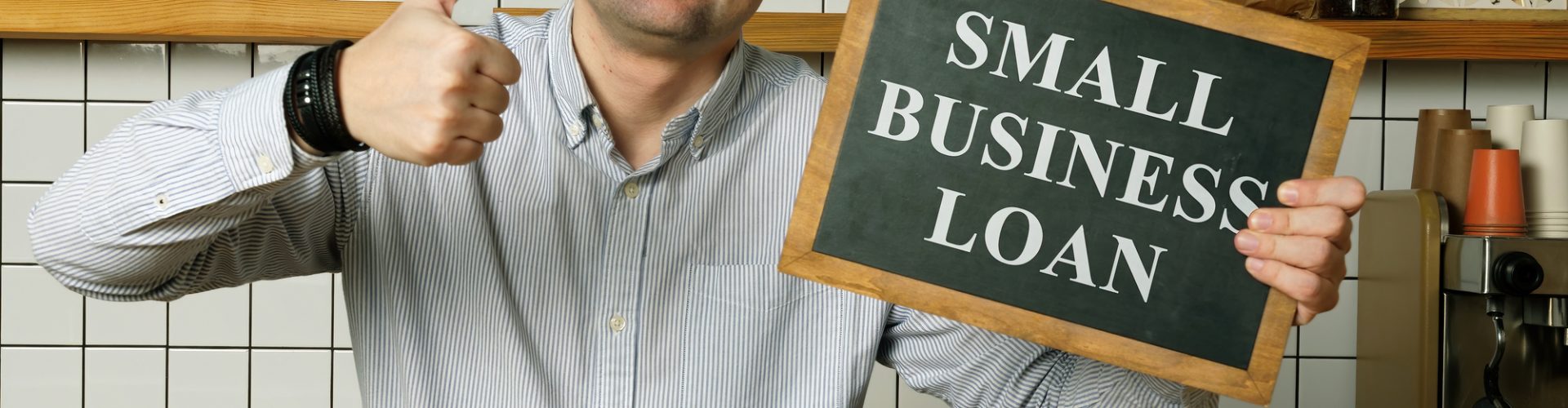 Small business loan in the businessman hands.