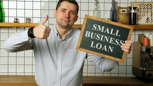 Small business loan in the businessman hands.