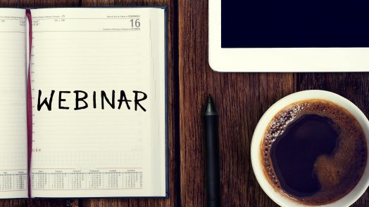 Webinar. Reminder in the calendar. Coffee with calendar and pencil on a wooden countertop. Reminder about training.