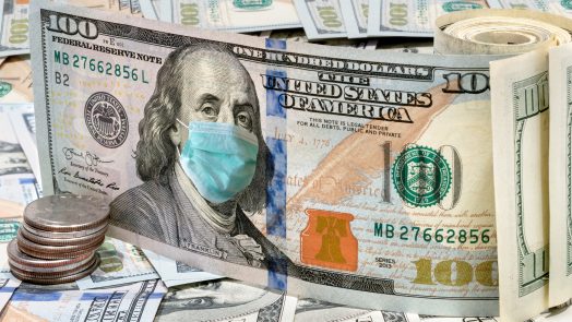 100 dollar money bills with medical face mask, COVID-19 coronavirus in USA.