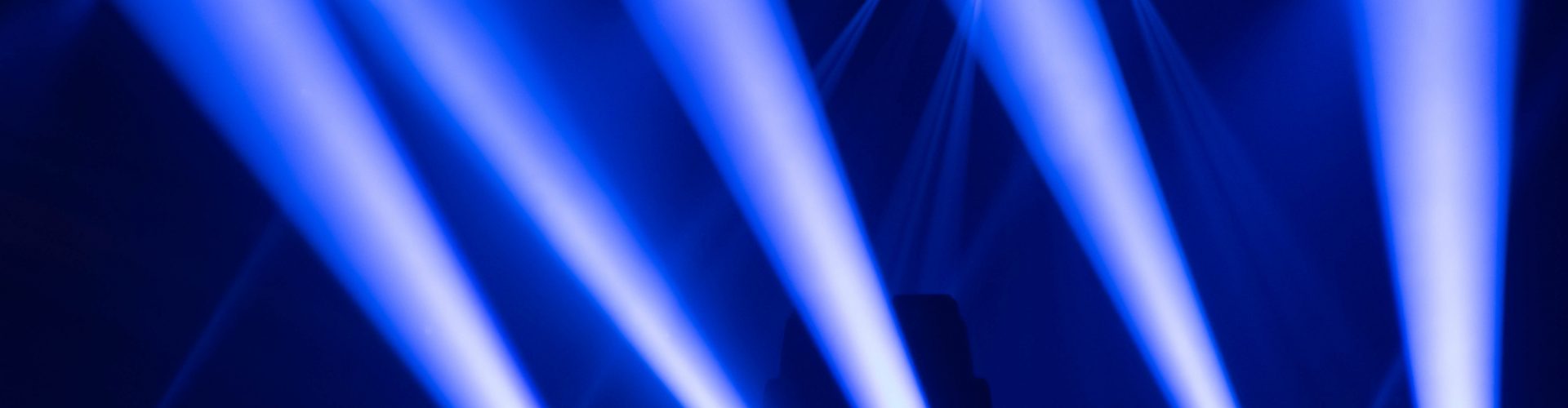Scene, stage lights with colored spotlights and smoke, laser lights background, white and blue