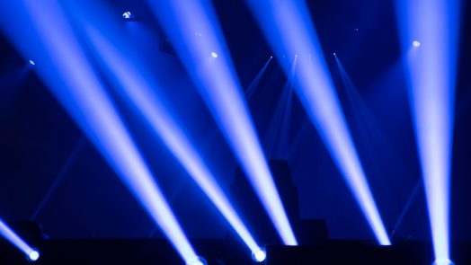 Scene, stage lights with colored spotlights and smoke, laser lights background, white and blue