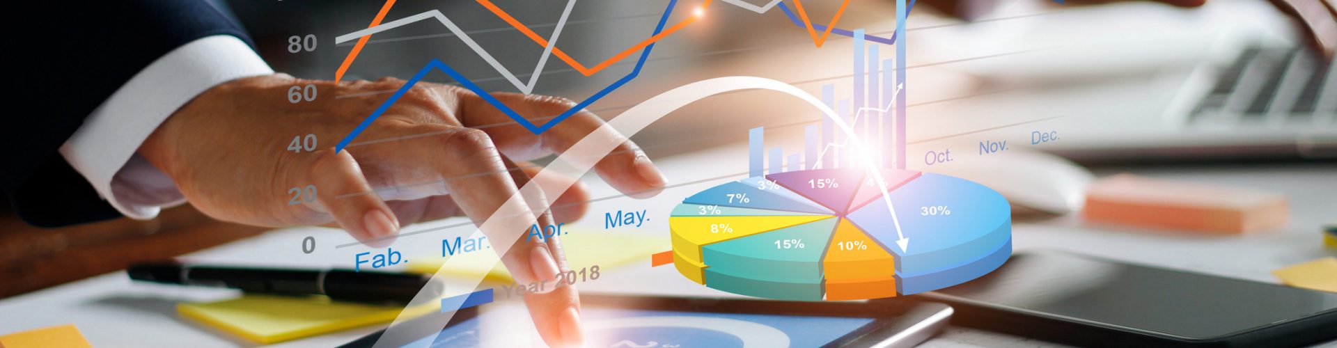 Businessman using tablet and laptop analyzing sales data and economic growth graph chart. Business strategy. Digital marketing. Business innovation technology concept